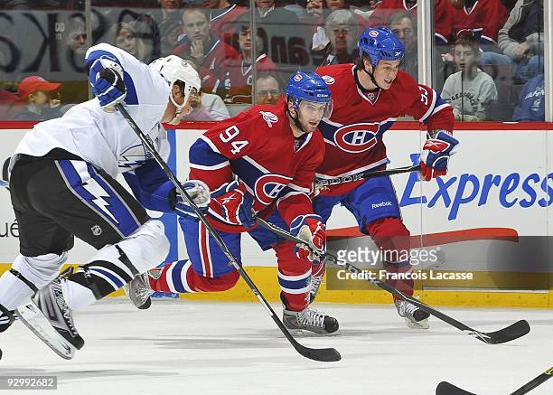 Tom Pyatt of the Montreal Canadiens and teammate Ryan White skate for position during the NHL game against the Tampa Bay Lightning on November 07,...