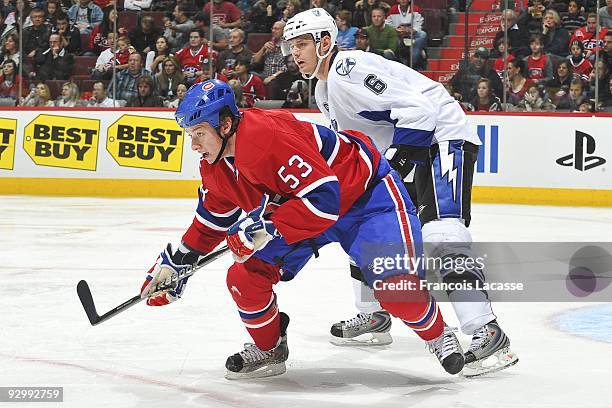 Ryan White of the Montreal Canadiens waits for a pass in front of Kurtis Foster of Tampa Bay Lightning during the NHL game on November 07, 2009 at...