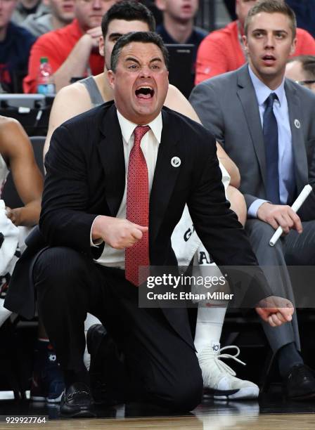 Head coach Sean Miller of the Arizona Wildcats yells to his players during a semifinal game of the Pac-12 basketball tournament against the UCLA...