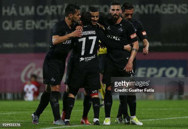 Coimbra midfielder Chiquinho from Portugal celebrates with teammates after scoring a goal during the Segunda Liga match between SL Benfica B and AA...