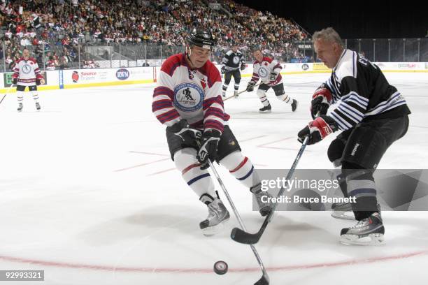 Dale Hawerchuk and Viacheslav Fetisov battle for the puck at the Hockey Hall of Fame Legends Game at the Air Canada Centre on November 8, 2009 in...