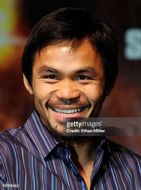 Boxer Manny Pacquiao smiles during the final news conference for his bout against WBO welterweight champion Miguel Cotto at the MGM Grand...