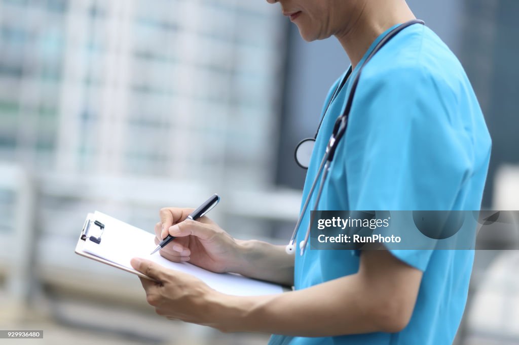 Doctor Taking Notes High-Res Stock Photo - Getty Images