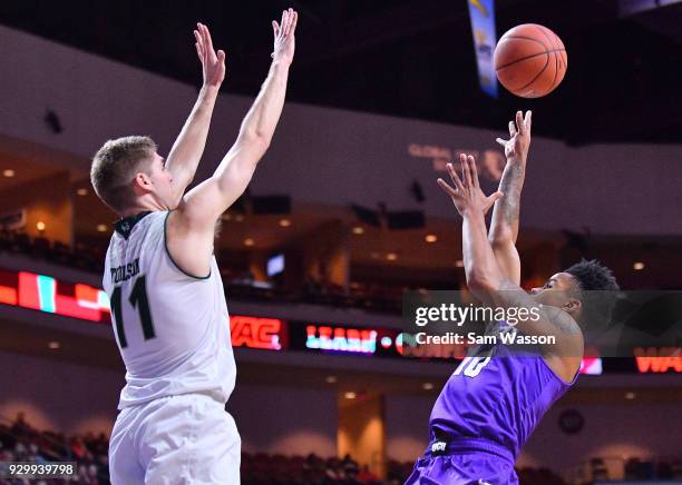 Damari Milstead of the Grand Canyon Lopes shoots against Conner Toolson of the Utah Valley Wolverines during a semifinal game of the Western Athletic...
