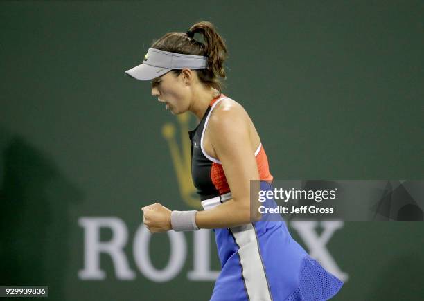 Garbine Muguruza of Spain reacts after winning a point against Sachia Vickery during the BNP Paribas Open at the Indian Wells Tennis Garden on March...