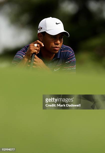 Tiger Woods of the USA lines up a putt on the 16th hole during round one of the 2009 Australian Masters at Kingston Heath Golf Club on November 12,...