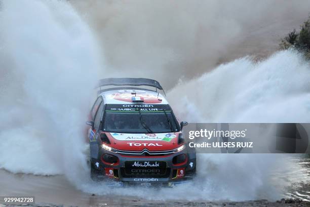 French driver Sebastien Loeb steers his Citroen C3 with co-driver Daniel Elena of Monaco, during the first day of the 2018 FIA World Rally...