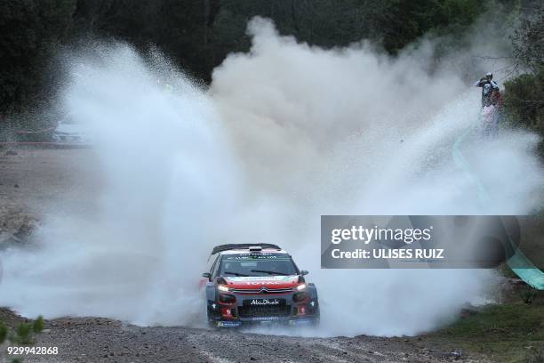 British driver Kris Meeke steers his Citroen C3 with Irish co-driver Paul Nagle, during the first day of the 2018 FIA World Rally Championship in...