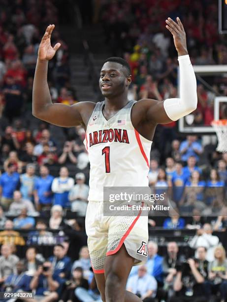 Rawle Alkins of the Arizona Wildcats celebrates on the court near the end of a semifinal game of the Pac-12 basketball tournament against the UCLA...