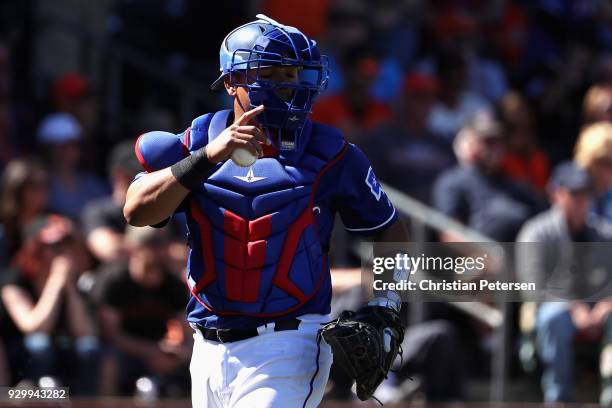 Catcher Juan Centeno of the Texas Rangers during the spring training game against the San Francisco Giants at Surprise Stadium on March 5, 2018 in...