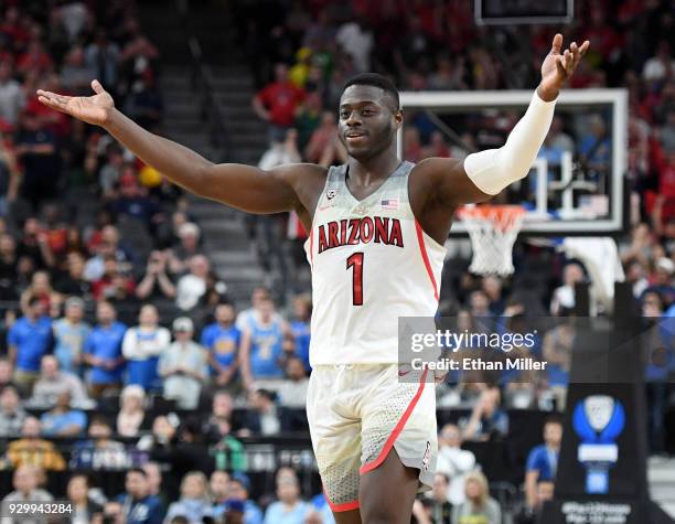 Rawle Alkins of the Arizona Wildcats celebrates on the court near the end of a semifinal game of the Pac-12 basketball tournament against the UCLA...