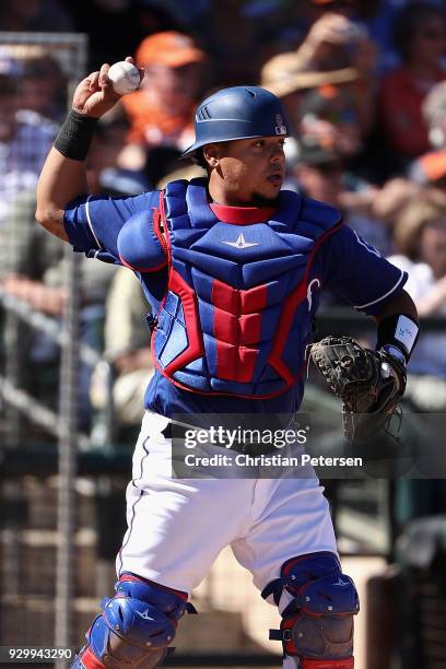 Catcher Juan Centeno of the Texas Rangers during the spring training game against the San Francisco Giants at Surprise Stadium on March 5, 2018 in...