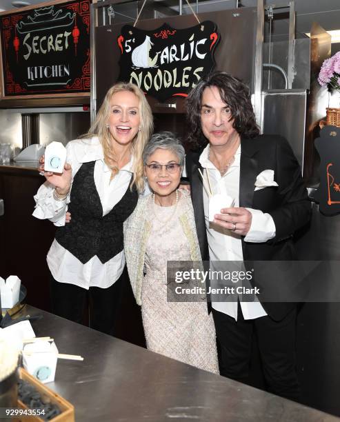 Erin Sutton and Paul Stanley of KISS pose with Chef Helene "Mama" An of House of An attend "An Iconic Affair" hosted by Crustacean Beverly Hills in...