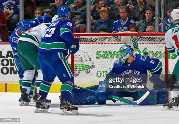 Anders Nilsson of the Vancouver Canucks blocks a shot during their NHL game against the Minnesota Wild at Rogers Arena March 9, 2018 in Vancouver,...