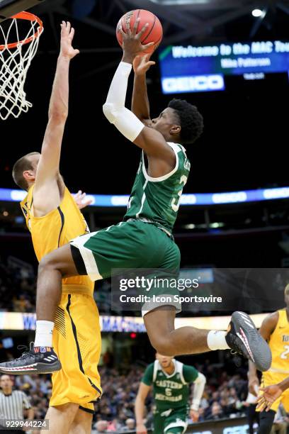Eastern Michigan Eagles guard Paul Jackson drives to the basket as Toledo Rockets forward/center Luke Knapke defends during the second half of the...