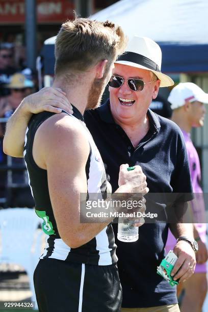Magpies President Eddie McGuire speaks to Sam Murray of the Magpies after their win during the JLT Community Series AFL match between Collingwood...