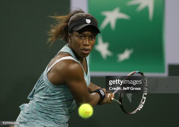 Sachia Vickery returns a backhand to Garbine Muguruza of Spain during the BNP Paribas Open at the Indian Wells Tennis Garden on March 9, 2018 in...