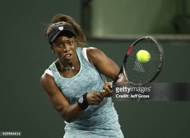 Sachia Vickery returns a backhand to Garbine Muguruza of Spain during the BNP Paribas Open at the Indian Wells Tennis Garden on March 9, 2018 in...