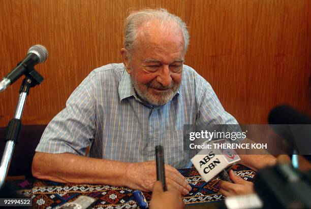 Released Irish priest Michael Sinnott speaks during a press conference at a military airbase in Zamboanga City on November 12 hours after he was...