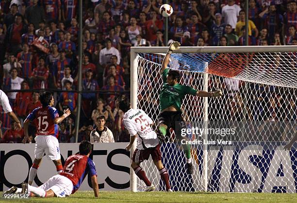 Goalkeeper Diego Barreto of Paraguay's Cerro Porteno vies for the ball with Dalton of Brazil's Fluminense during their match as part of the Copa...