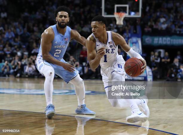 Trevon Duval of the Duke Blue Devils drives against Joel Berry II of the North Carolina Tar Heels during the semifinals of the ACC Men's Basketball...