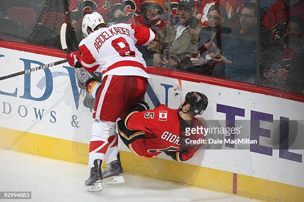Justin Abdelkader of the Detroit Red Wings checks Mark Giordano of the Calgary Flames during their game on October 31, 2009 at the Pengrowth...