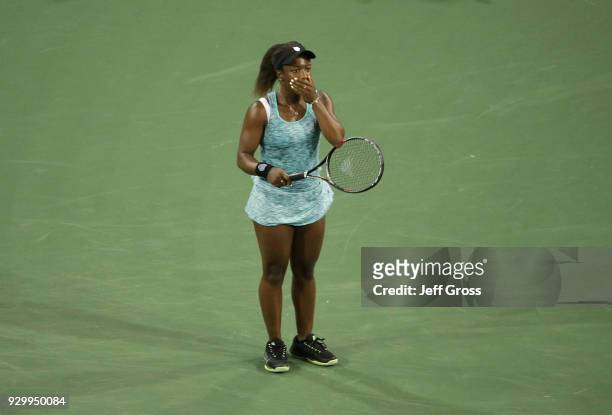 Sachia Vickery reacts following her victory over Garbine Muguruza of Spain during the BNP Paribas Open at the Indian Wells Tennis Garden on March 9,...