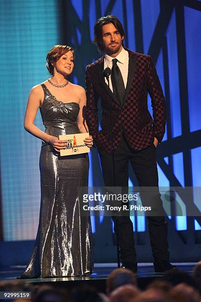 Singers Kellie Pickler and Jake Owen present the Song of the Year award onstage during the 43rd Annual CMA Awards at the Sommet Center on November...