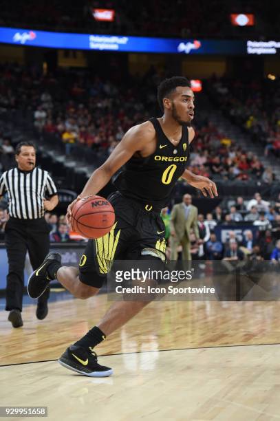 Oregon forward Troy Brown drives to the basket during the PAC-12 Men's Basketball Tournament semifinal game between the Oregon Ducks and the USC...