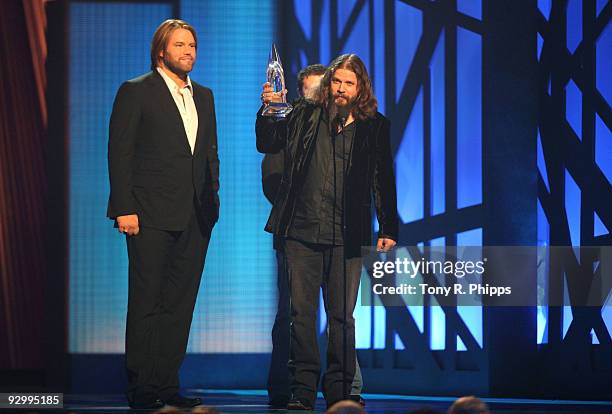 Musician Jamey Johnson accepts the award for Song of the Year with James Otto onstage during the 43rd Annual CMA Awards at the Sommet Center on...