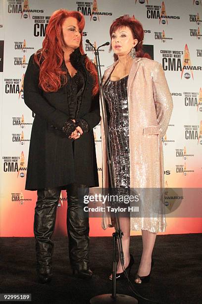 Singers Wynonna Judd and Naomi Judd pose in the press room at the 43rd Annual CMA Awards at the Sommet Center on November 11, 2009 in Nashville,...