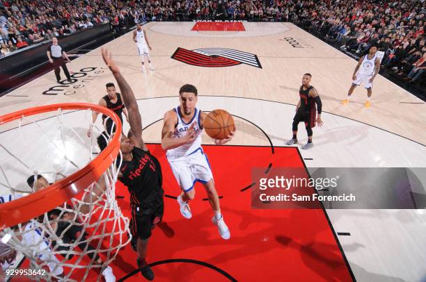 Klay Thompson of the Golden State Warriors shoots the ball against the Portland Trail Blazers on March 9, 2018 at the Moda Center in Portland,...