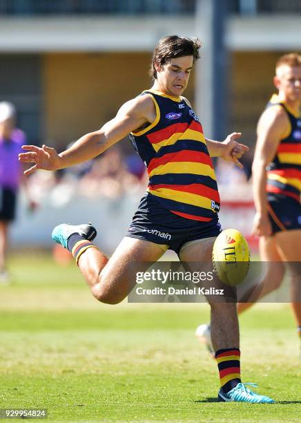 Darcy Fogarty of the Crows kicks the ball during the JLT Community Series AFL match between Port Adelaide Power and the Adelaide Crows at Alberton...