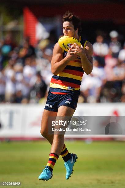 Darcy Fogarty of the Crows marks the ball during the JLT Community Series AFL match between Port Adelaide Power and the Adelaide Crows at Alberton...