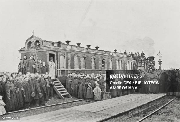 Easter blessing in a makeshift church in a railroad car, Trans-Siberian Railway, Russia, photograph by Topical, from L'Illustrazione Italiana, Year...