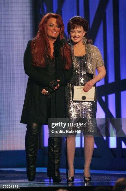 Singers Wynonna Judd and Naomi Judd performs onstage at the 43rd Annual CMA Awards at the Sommet Center on November 11, 2009 in Nashville, Tennessee.