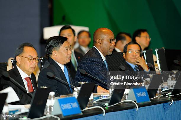 Ron Kirk, U.S. Trade representative, center, attends the Asia-Pacific Economic Cooperation Finance Ministers' ministerial retreat, in Singapore, on...