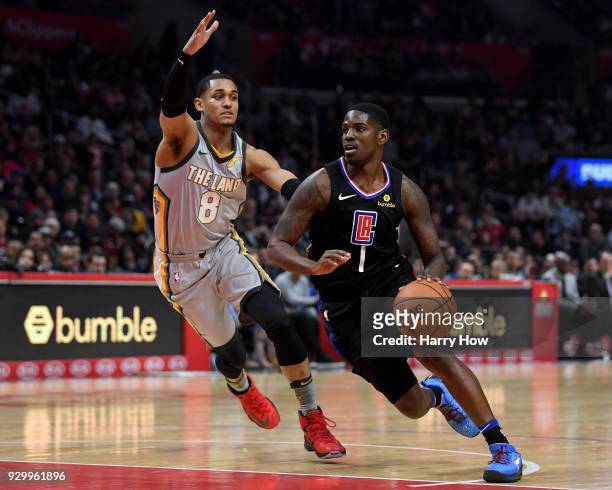 Jawun Evans of the LA Clippers drives past Jordan Clarkson of the Cleveland Cavaliers during a 116-102 Clipper win at Staples Center on March 9, 2018...