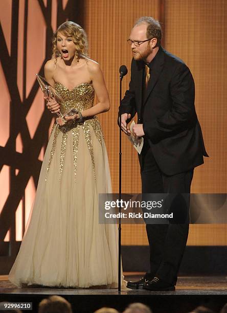 Musician Taylor Swift accepts the award for Album of the Year with producer Nathan Chapman during the 43rd Annual CMA Awards at the Sommet Center on...
