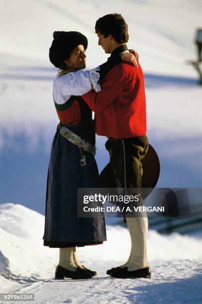 Young Ladin couple wearing traditional clothes, Val Badia, Trentino-Alto Adige, Italy.
