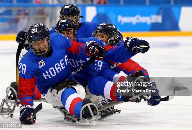 Dong Shin Jang of Korea celebrates after he scores the opening goal in the Ice Hockey Preliminary Round - Group B game between South Korea and Japan...