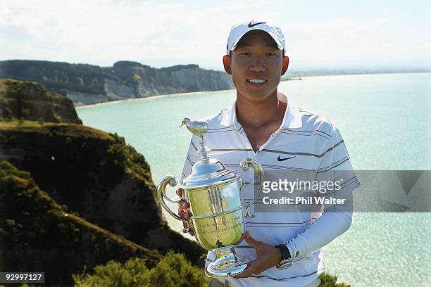 Anthony Kim of the USA holds the Kiwi Challenge trophy following the second round of The Kiwi Challenge at Cape Kidnappers on November 12, 2009 in...