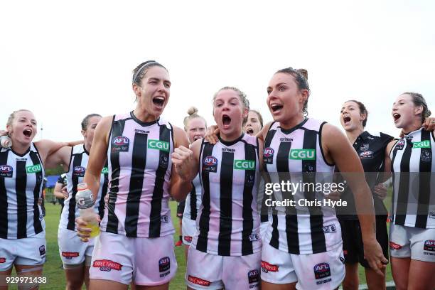 Magpies celebrate winning the round six AFLW match between the Brisbane Lions and the Collingwood Magpies at Moreton Bay Sports Complex on March 10,...