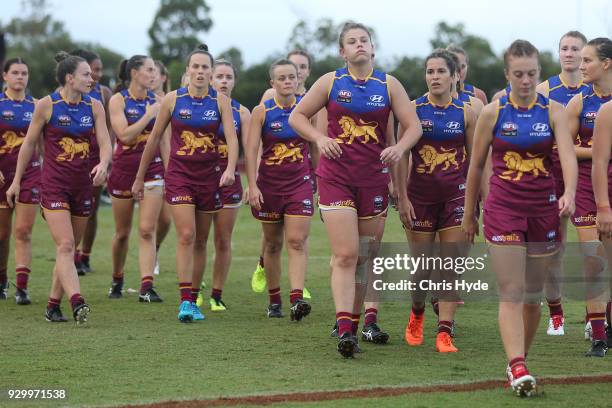 Lions leave the field after losing the round six AFLW match between the Brisbane Lions and the Collingwood Magpies at Moreton Bay Sports Complex on...