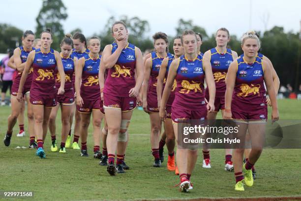 Lions leave the field after losing the round six AFLW match between the Brisbane Lions and the Collingwood Magpies at Moreton Bay Sports Complex on...