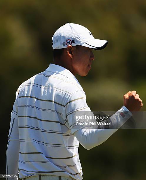 Anthony Kim of the USA celebrates a shot on the 10th green during the second round of The Kiwi Challenge at Cape Kidnappers on November 12, 2009 in...