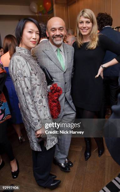 Pianist Rosey Chan, designer Christian Louboutin and actress Meredith Ostrom attend the Lanvin Party to celebrate the release of Mika's EP 'Songs Of...