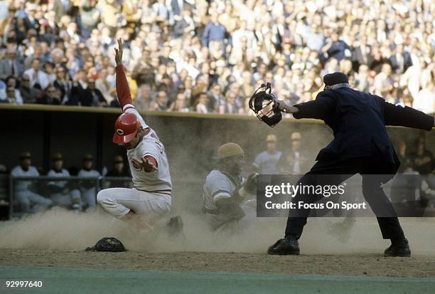 S: Outfielder Pete Rose of the Cincinnati Reds slides in safe at homeplate against the Pittsburgh Pirtates during a MLB baseball game circa early...