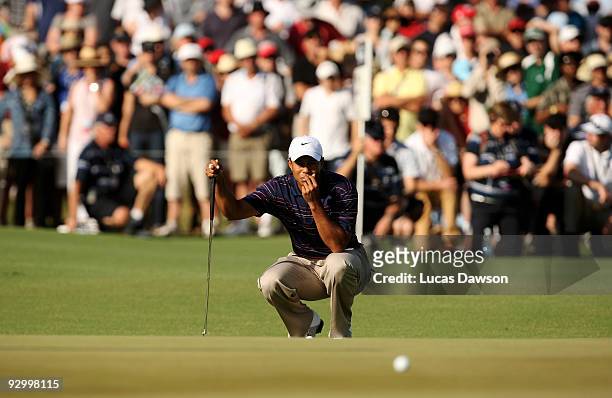 Tiger Woods of the USA putts on the 14th hole during round one of the 2009 Australian Masters at Kingston Heath Golf Club on November 12, 2009 in...