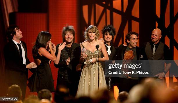 Taylor Swift along with her backup band onstage at the 43rd Annual CMA Awards at the Sommet Center on November 11, 2009 in Nashville, Tennessee.
